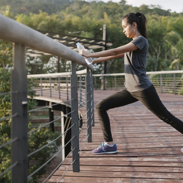 Active Woman Stretching Outdoors